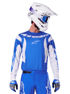 Alpinestars 2025 Fluid Haul Jersey, Motocross Jersey, Blue and White, worn with matching pants and gloves, white helmet with blue goggles, coordinated MX gear set for off-road riding