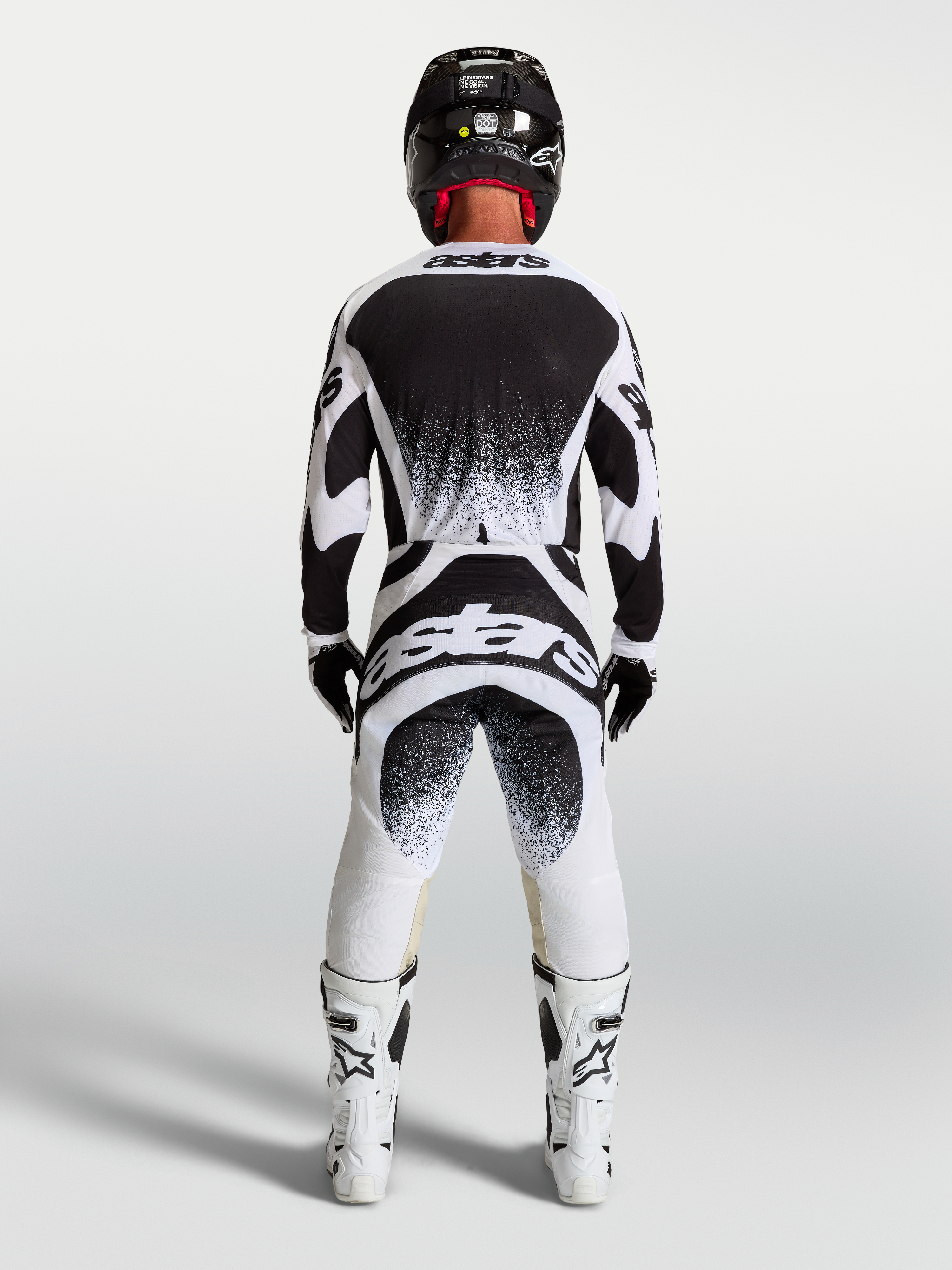 Jersey y conjunto Techstar Swan de Alpinestars para motocross, blanco y negro con gráficos traseros de efecto salpicadura.