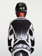 Jersey Alpinestars Techstar Swan, para motocross de hombre, blanco y negro, vista trasera con ajuste atlético y gráficos
