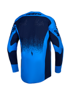 Jersey Alpinestars Techstar Swan, jersey de motocross azul con perforaciones láser y dobladillo trasero extendido.