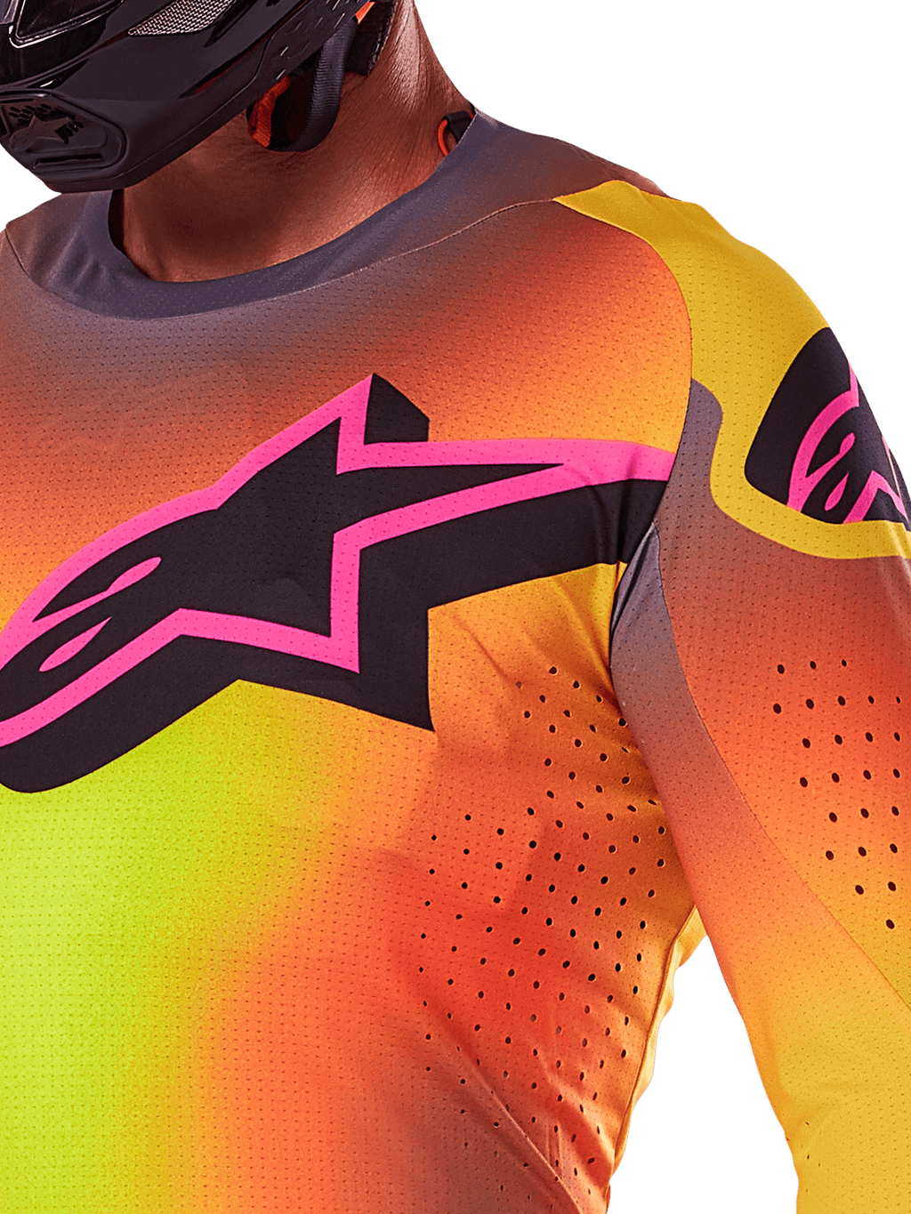 Primer plano del jersey Alpinestars Supertech Lipan 2025 en color amarillo y rosa, con un vibrante diseño degradado, un gran logotipo de estrella negra con borde rosa en el pecho y perforaciones cortadas con láser visibles para un mayor flujo de aire.