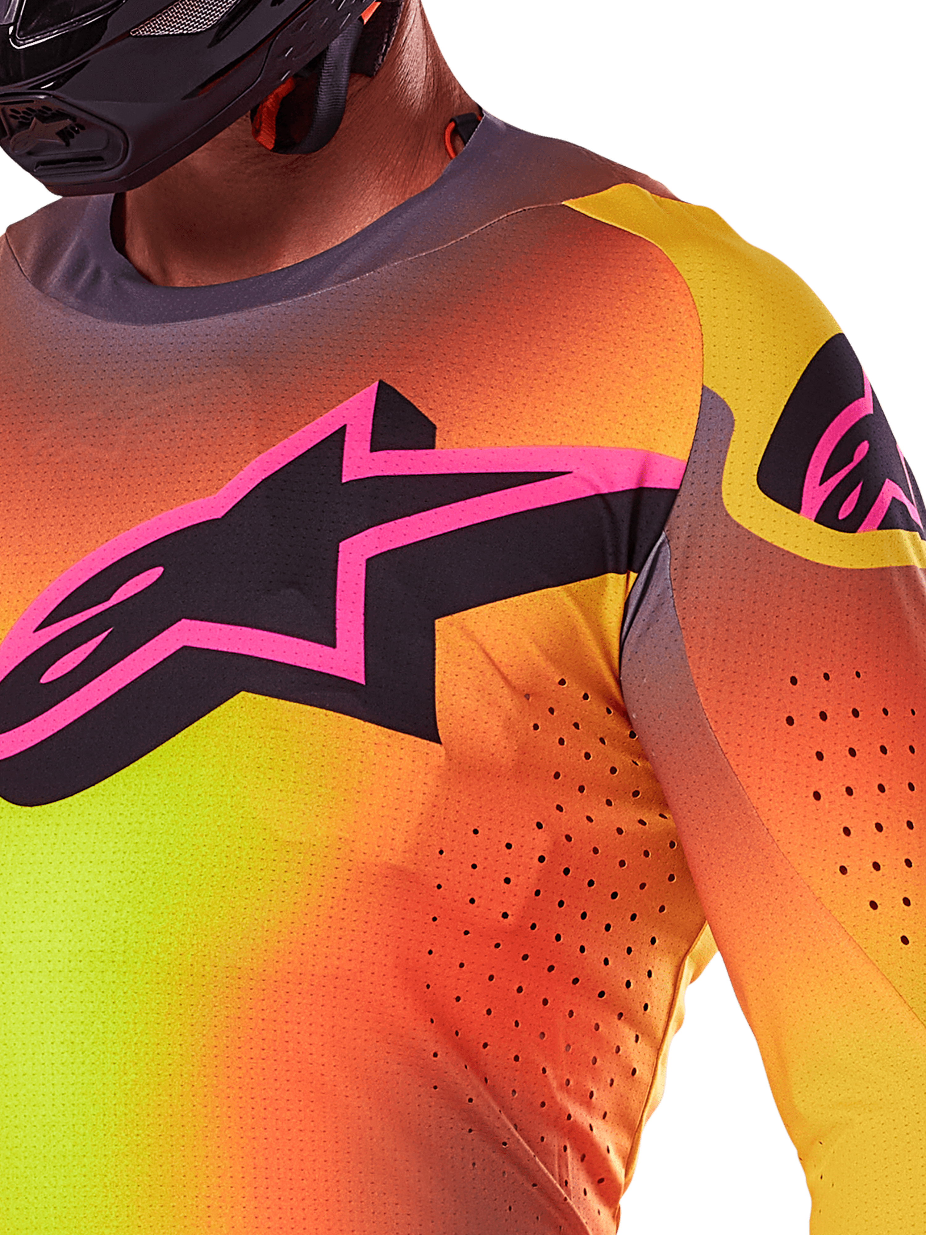 Close-up of the Alpinestars 2025 Supertech Lipan Jersey in Yellow Pink, featuring a vibrant gradient design, a large black star logo with a pink border on the chest, and visible laser-cut perforations for enhanced airflow.