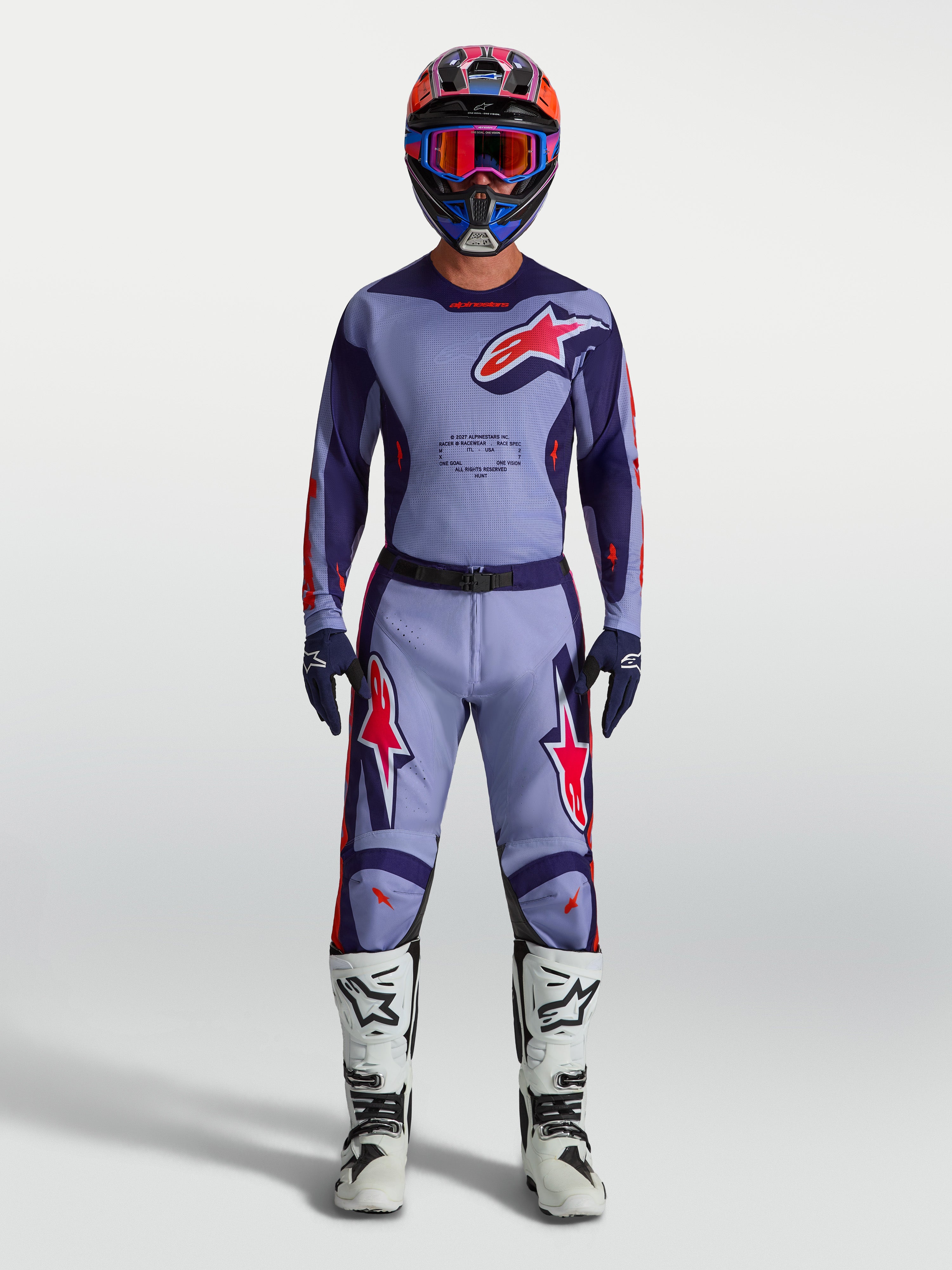 Jersey Racer Air Hunt de Alpinestars, equipo de motocross para hombre en morado y rosa fluorescente con malla ventilada.