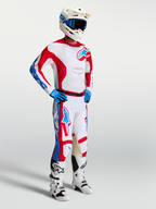 Alpinestars Racer Hunt, conjunto de motocross rojo y blanco con jersey y pantalones para conducción off-road.
