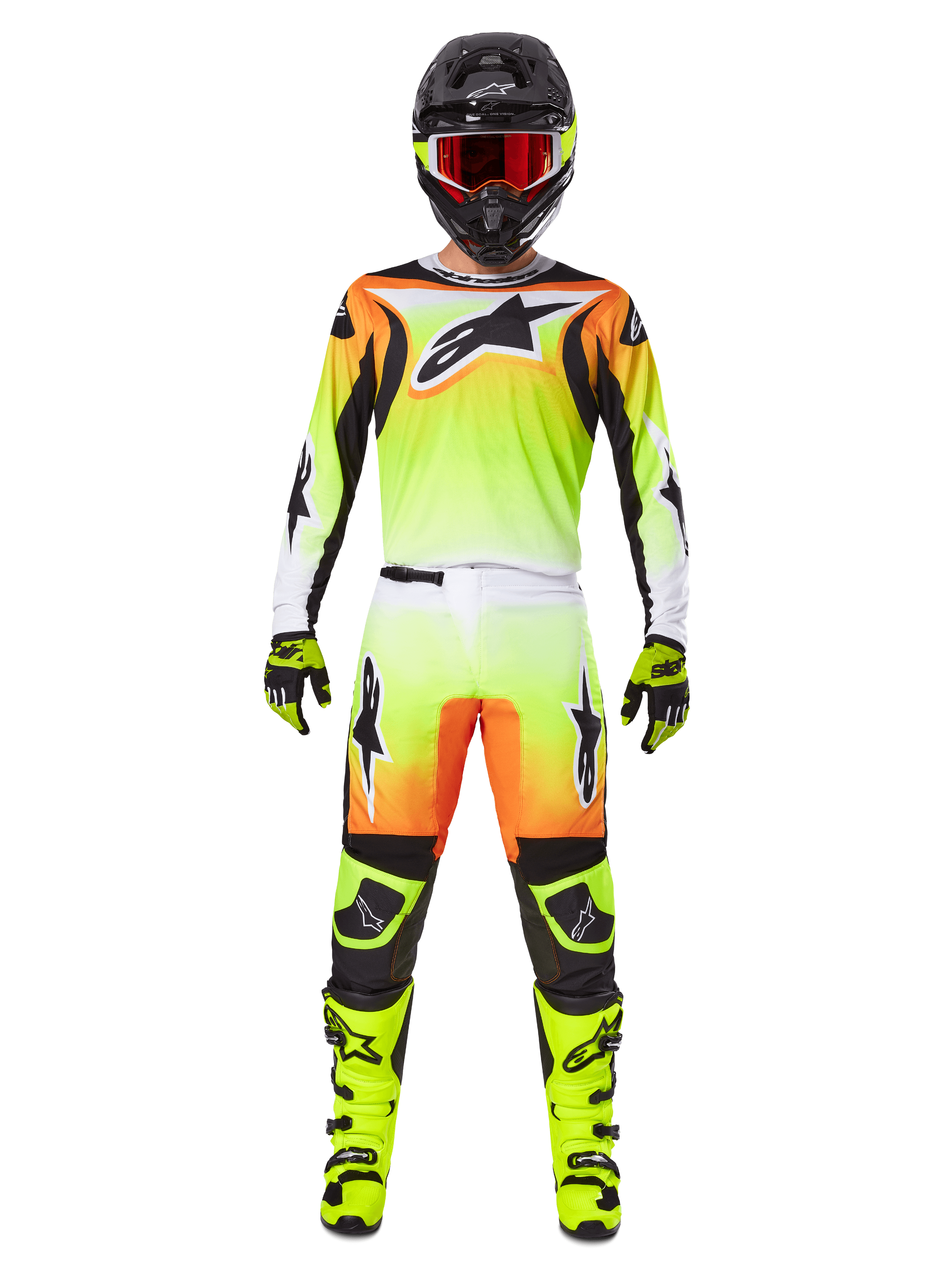 Motocross rider wearing complete racing gear, Alpinestars 2025 Fluid Wurx Gear Set, Yellow and Black with orange and white accents, jersey with large front logo, matching pants, black helmet with red-tinted goggles, neon yellow boots, coordinated outfit for off-road racing