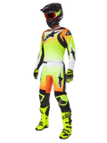 Alpinestars 2025 Fluid Wurx Gear Set, conjunto de competición de motocross, degradado amarillo neón y naranja, kit completo con jersey y pantalones, casco negro con gafas naranjas, botas y guantes amarillo neón, diseño atlético para rendimiento todoterreno