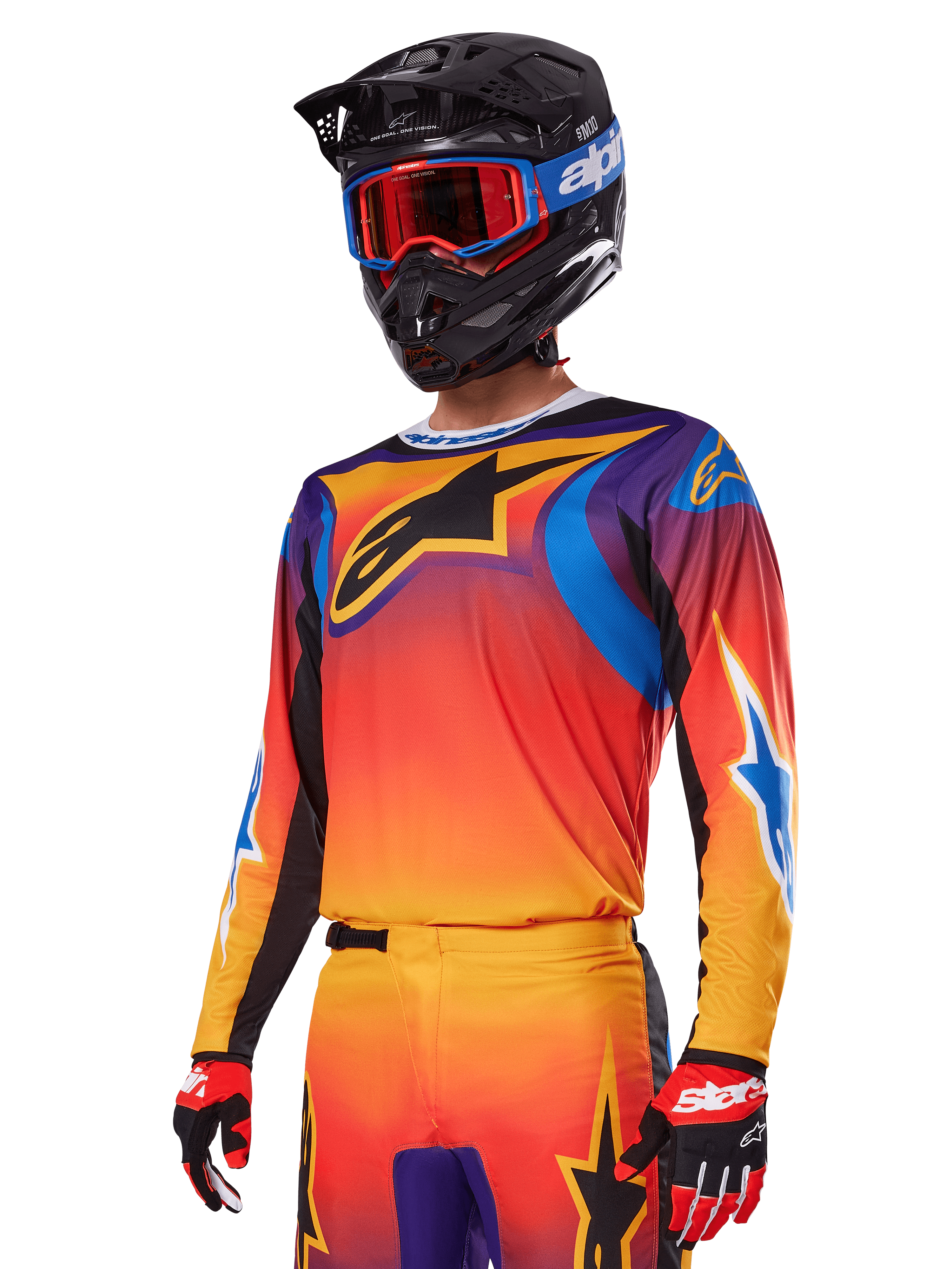 Alpinestars 2025 Fluid Wurx Gear Set, conjunto de equipo de motocross, degradado naranja, púrpura y azul, con un gran logotipo negro de A-stars, usado con casco negro y gafas azules, conjunto coordinado para carreras profesionales todoterreno