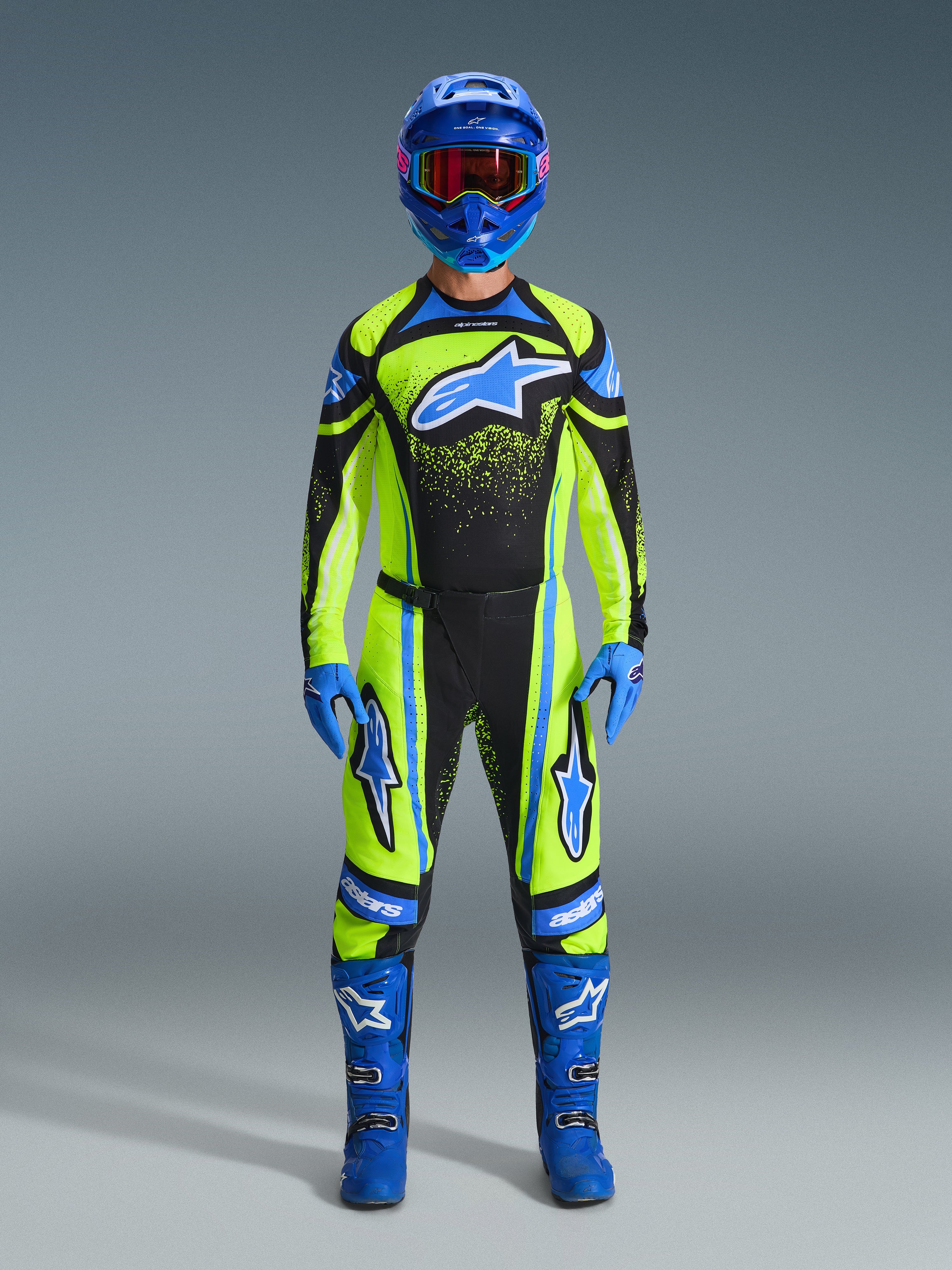 Alpinestars 2026 Techstar Nomur Gear Set, full motocross racing outfit, neon yellow and black with blue accents, complete gear set including helmet, gloves, and boots, athletic race fit with star graphics, professional MX protection