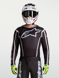 Alpinestars Fluid Apex V2, jersey de motocross para hombre, negro y plateado con logotipo de estrella grande, ajuste atlético.