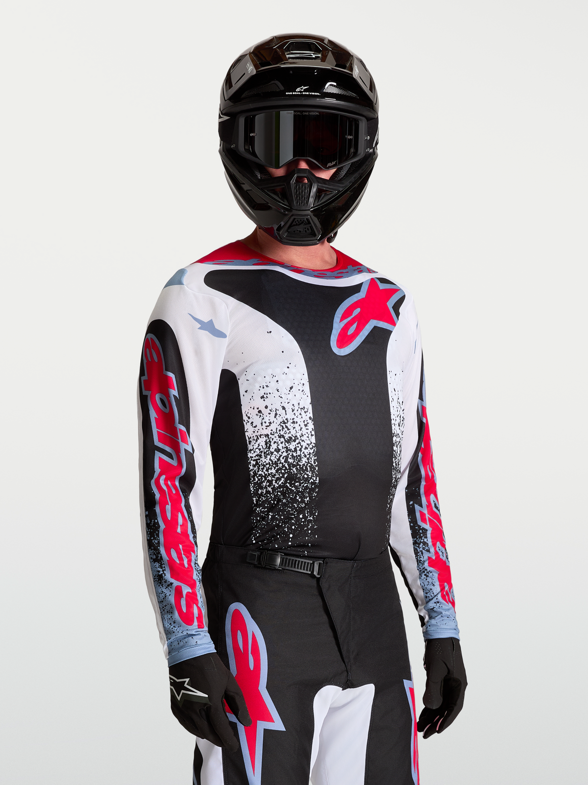 Alpinestars Jersey Fluid Drag, jersey de motocross de hombre, negro y blanco con rojo y azul, tejido transpirable.