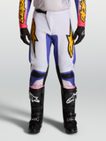 Alpinestars Pantalones Fluid Drag 2027, pantalones de motocross para hombre, lila claro y azul iris con detalles dorados.
