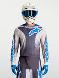 Alpinestars Jersey Fluid Drag, equipo de motocross para hombre en gris y azul, construcción ligera y transpirable.