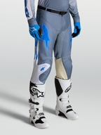 Alpinestars Racer Amber, pantalones de motocross para hombre, gris y azul cian, con paneles de rodilla en cuero y botas Techstar blancas