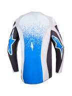 Jersey Alpinestars Fluid Drag para motocross, vista trasera en color azul y gris con gráficos de salpicaduras y logotipos de estrella