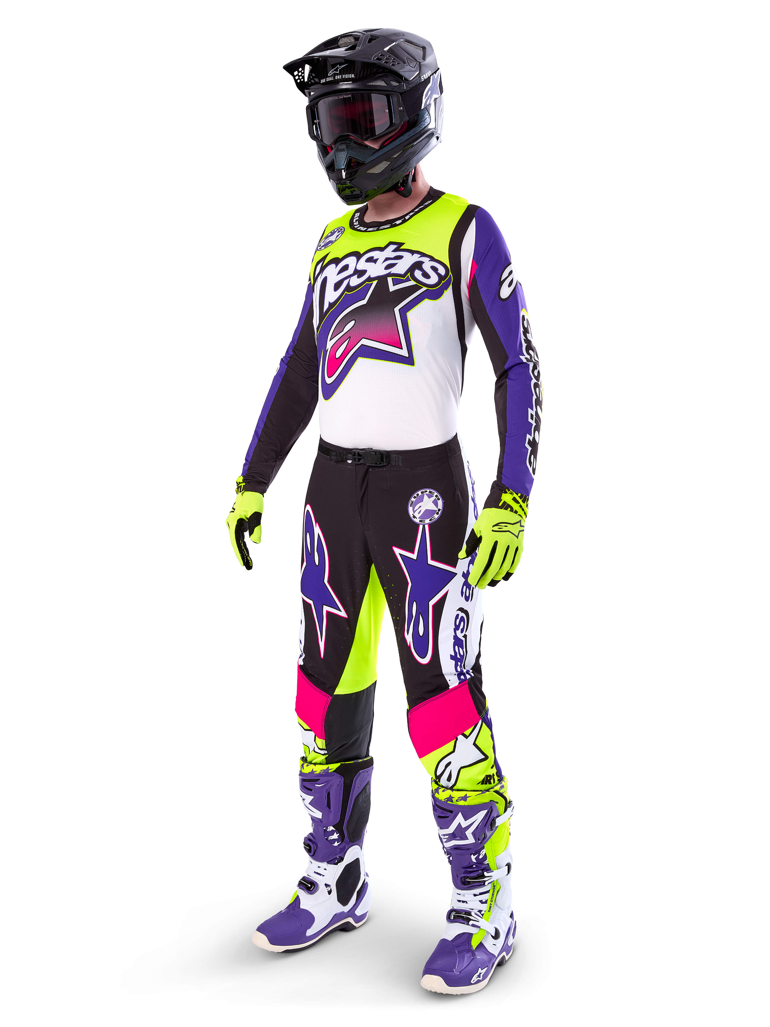 Motocross rider wearing Alpinestars Limited Edition Supertech Dirt Studios® gear, White Purple and Yellow Fluo color scheme, black pants with bold purple and pink star logos, neon yellow gloves, purple and white racing boots, black helmet, complete professional racing kit for off-road performance