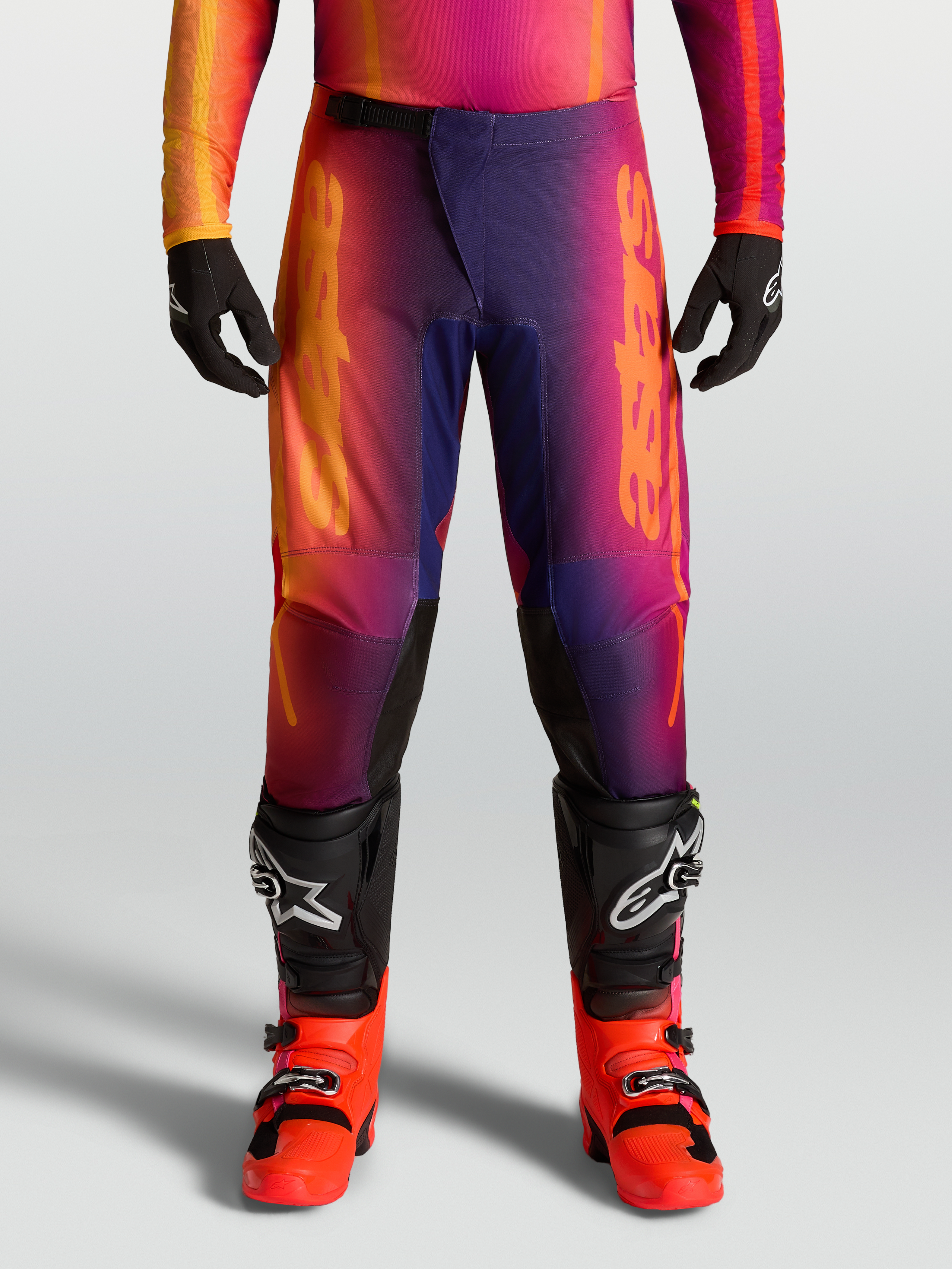 Alpinestars Pantalones Fluid Kepler 2027, pantalones de motocross con degradado morado y naranja, diseño deportivo precurvado