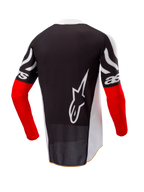 Alpinestars Techstar Deep Jersey Edición Limitada, jersey de motocross, vista trasera, negro y blanco con mangas en rojo intenso, gran logotipo blanco de Alpinestars en la espalda, ajuste atlético de competición con tejido de poliéster perforado.