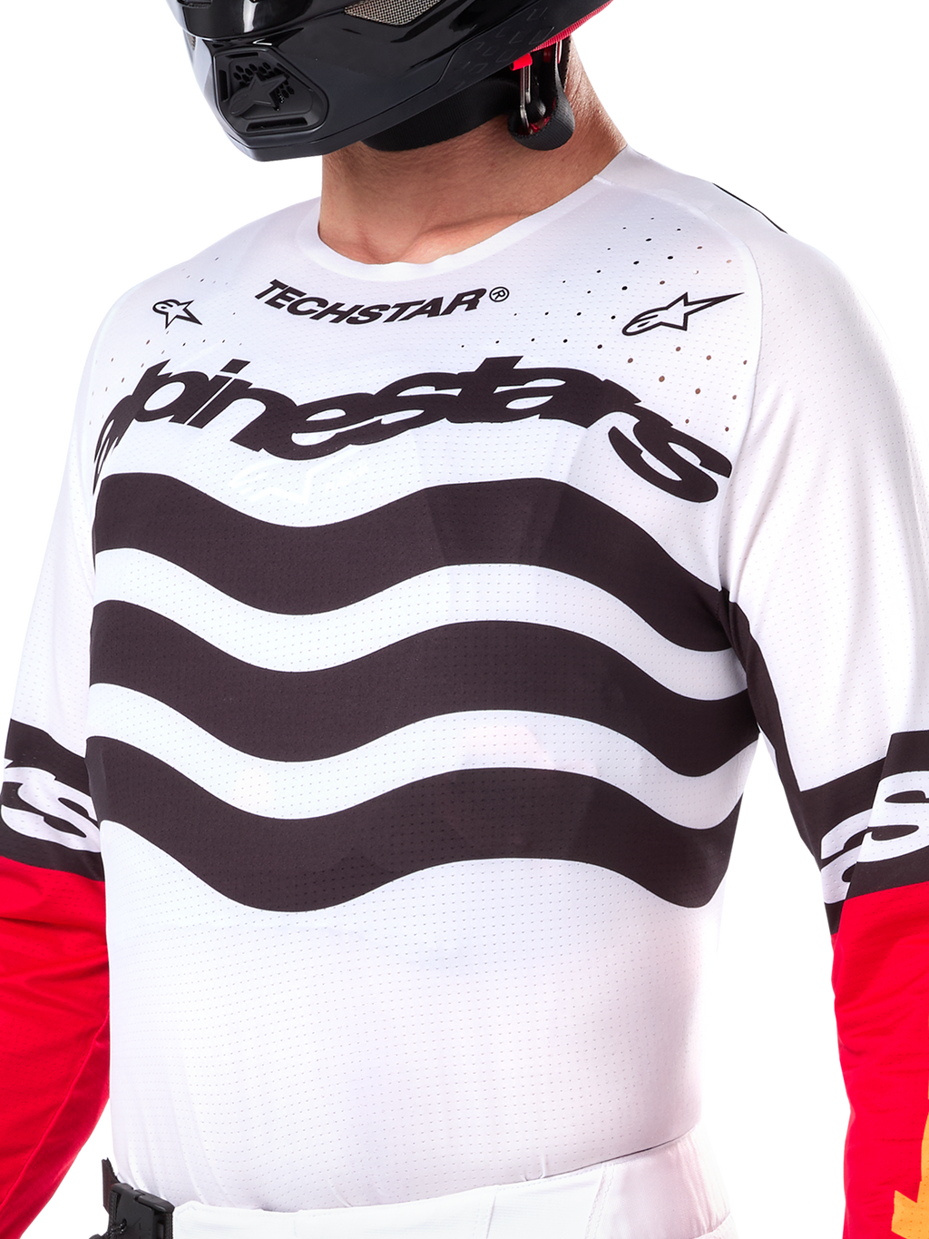 Alpinestars Limited Edition Techstar Deep Jersey, jersey de motocross blanco con rayas negras horizontales onduladas y mangas rojas, con logotipos de Alpinestars y Techstar, pequeñas perforaciones cortadas con láser en la parte superior del pecho para ventilación, equipamiento deportivo para off-road