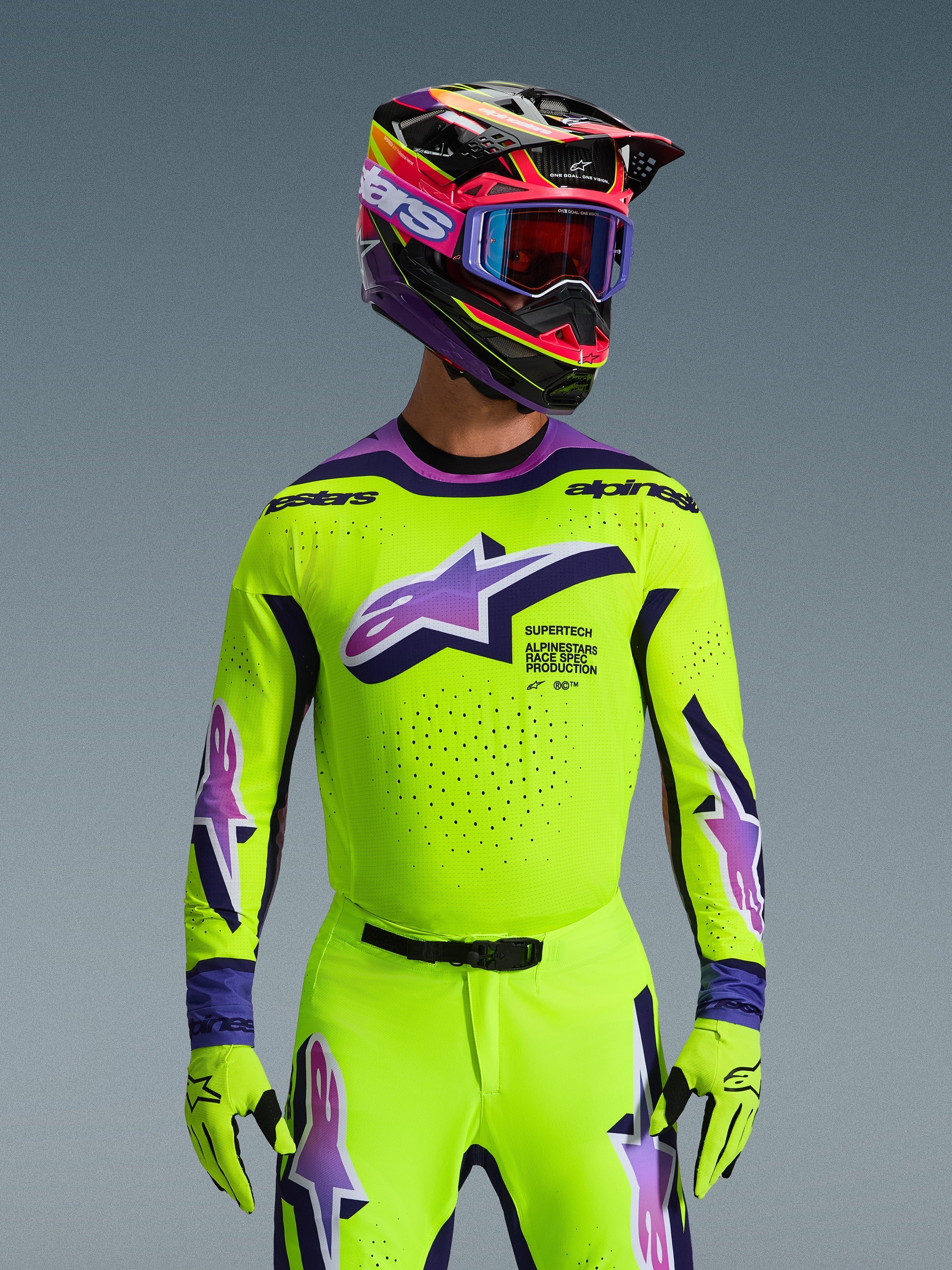 Alpinestars 2026 Supertech Vista Jersey, Motocross Jersey, Bright Neon Yellow with Purple and Black accents, worn with matching motocross helmet, goggles, and gloves, pro-level athletic fit for off-road racing