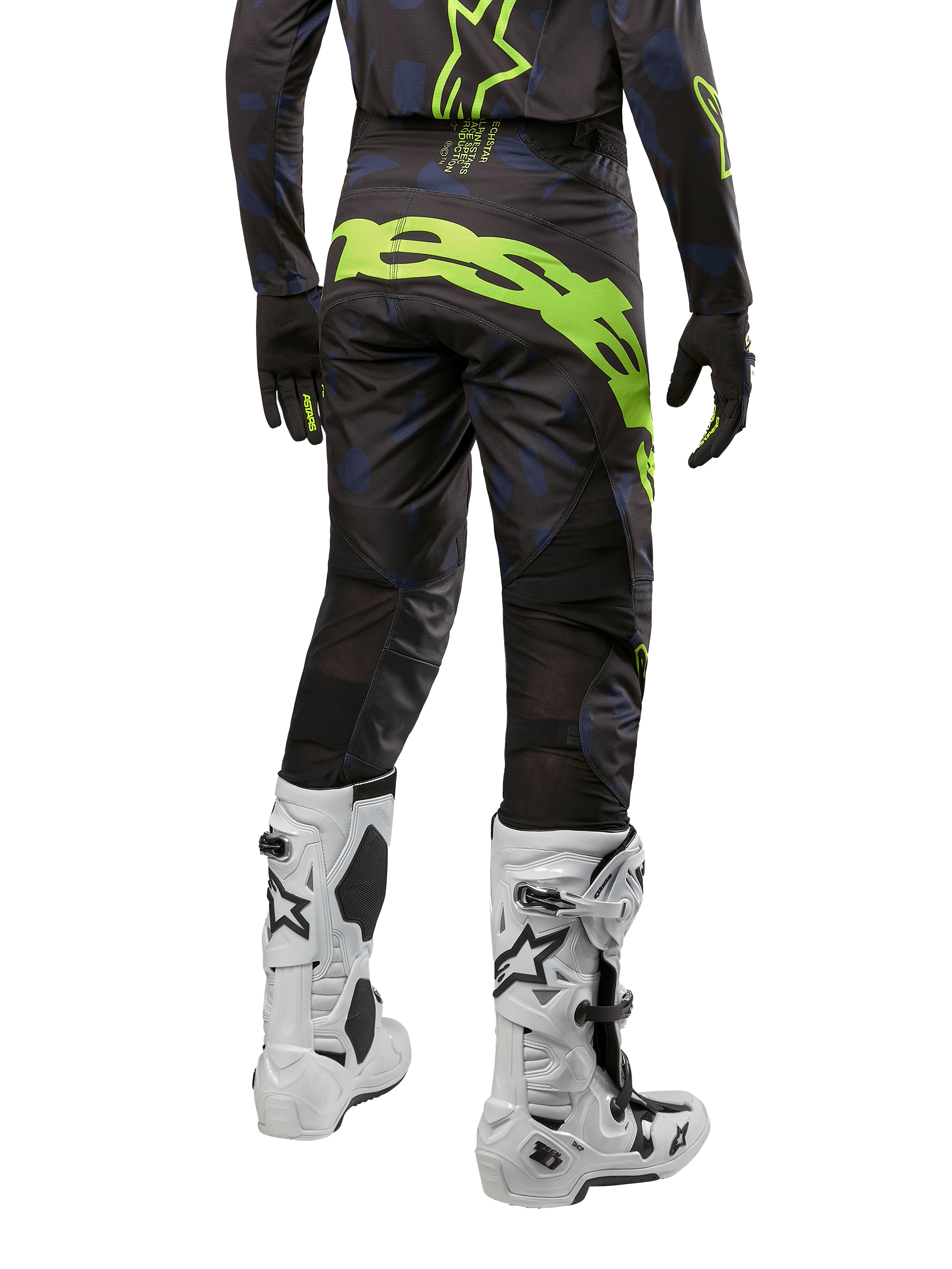 Alpinestars 2024 Techstar Rantera Pants, Motocross Pants, Black Navy and Yellow Fluo, back view, featuring bold neon yellow branding and mesh ventilation panels, worn with matching jersey and white boots, durable gear for motocross and off-road racing