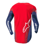 Alpinestars 2024 Techstar Pneuma Jersey, jersey de motocross, rojo, azul y blanco, vista trasera que muestra gráficos ondulados en las mangas, marca Alpinestars blanca en los brazos y logotipo Astar en la parte inferior de la espalda, diseño ergonómico para conducción todoterreno