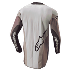 Alpinestars Techstar Pneuma Jersey 2024, jersey de motocross, vista trasera en color Dark Sand Iron Dust Gray, con un gran logotipo de Alpinestars y marca en las mangas, ajuste atlético con paneles de bloques de color y parte trasera extendida para mayor cobertura.