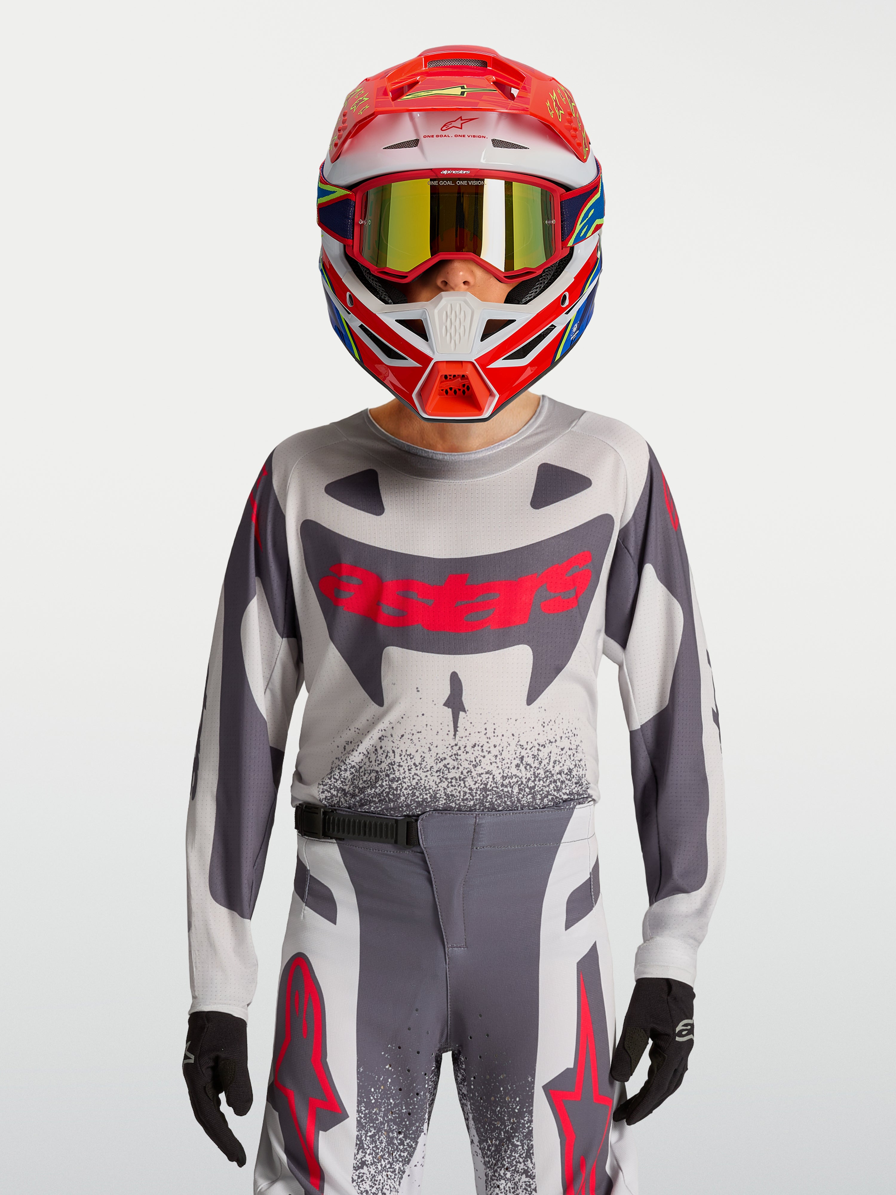 Alpinestars Youth Supertech Swan Jersey and Gear Set, gray and red fluo motocross outfit in breathable stretch mesh.