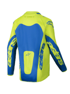 Alpinestars Youth Racer Veil Jersey 2025, jersey de motocross juvenil, amarillo flúor y azul, vista trasera con paneles azules llamativos y marca astars en las mangas, diseño con corte más largo en la parte trasera para mayor cobertura, tejido ligero que absorbe la humedad para carreras todoterreno