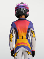 Alpinestars jersey Fluid Drag juvenil 2027, jersey de motocross azul y amarillo, vista trasera con gráficos de carreras