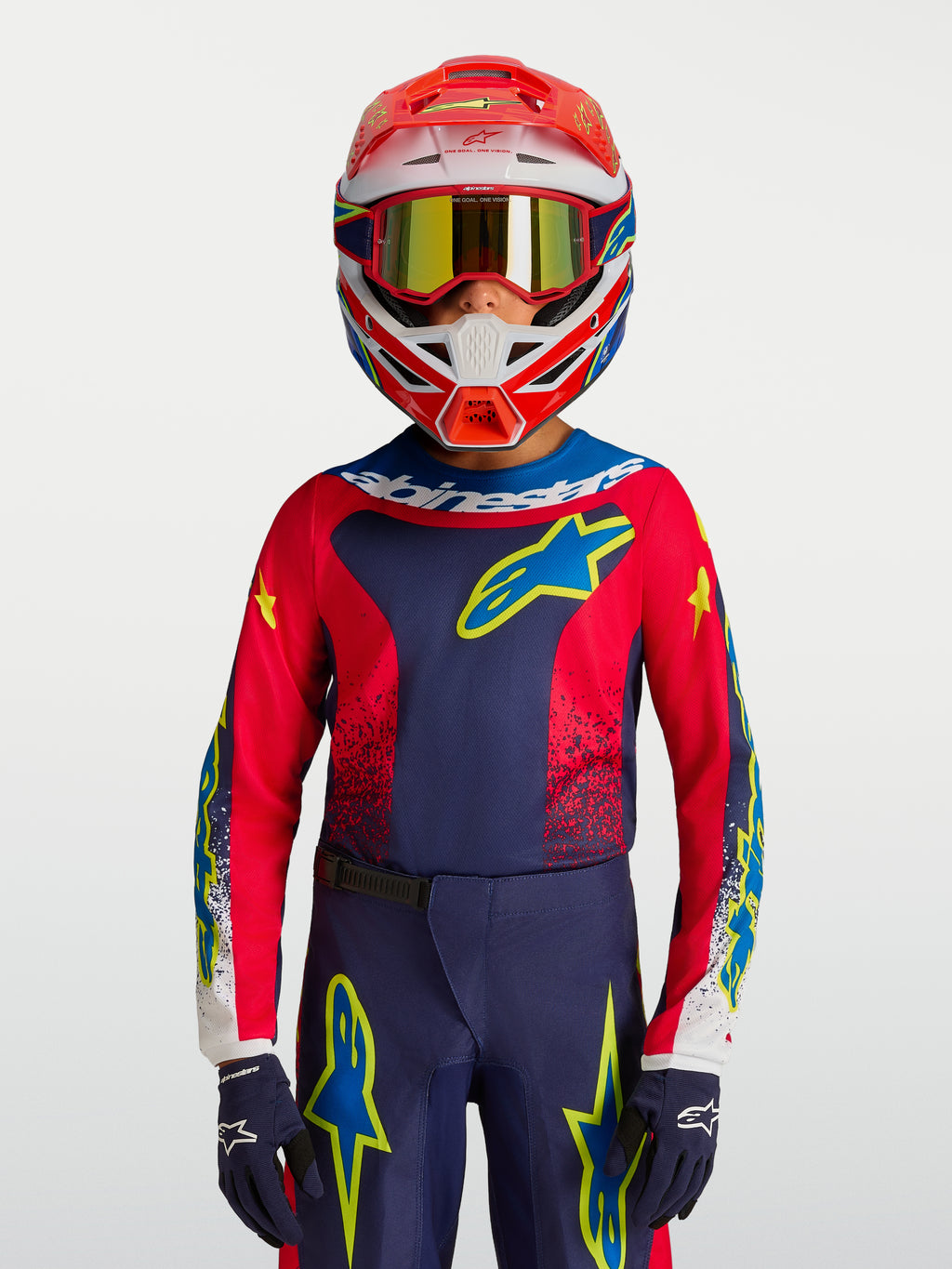 Alpinestars Jersey Fluid Drag Juvenil 2027, jersey de motocross azul marino y rojo con detalles amarillos para jóvenes.