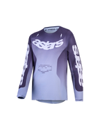 Alpinestars Fluid Amber, jersey de motocross juvenil, degradado morado y gris con logotipos Astars y diseño técnico off-road.