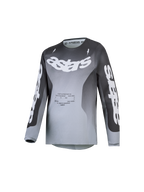 Alpinestars Jersey Fluid Amber Juvenil 2027, jersey de motocross juvenil, degradado en gris y blanco, tejido técnico transpirable que absorbe la humedad y logotipos astars