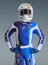 Youth motocross rider wearing the 2026 Youth Fluid Portl Jersey in Ucla Blue White, matching blue and white motocross pants, blue and black gloves, and a white helmet with goggles, complete racing gear for young off-road riders.