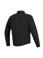 Sobrecamisa Alpinestars Bryon resistente al agua, negro, vista posterior, confeccionada en lona encerada duradera, con canesú horizontal en los hombros, presilla trasera para colgar y parte trasera ligeramente más larga para mayor cobertura al conducir motocicletas.