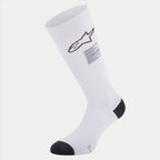 Calcetines Alpinestars ZX V4, calcetines para automovilismo, blancos con detalles negros en el talón y la puntera, con logotipo de Alpinestars en negro y etiqueta de cumplimiento FIA, capa base técnica sin costuras para deportes de motor