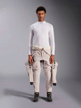 Alpinestars ZX Evo V3 Top, Long Sleeve, White, auto racing base layer worn with a light-colored racing suit tied around the waist and black racing boots, featuring a mock neck with logo and shoulder branding, professional flame-resistant motorsport underwear