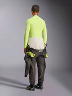 Alpinestars ZX Evo V3 Long Sleeve Top, Yellow Fluo, rear view of model wearing fire-resistant base layer with dark racing suit pants and boots, professional motorsport technical underwear
