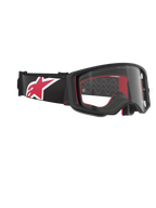 Alpinestars Supertech Corp Goggles, Motocross Goggles, Black Red and Clear, side-angled view featuring a clear lens and black frame, red interior padding, black strap with a large red and white Alpinestars logo, professional off-road eye protection