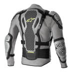 Chaqueta de protección Alpinestars Bionic Action V2, vista posterior, gris y negra con detalles en amarillo flúor, con protectores de espalda, hombros y codos con tecnología Cell altamente perforada, chasis de malla gris con correas ajustables negras y logotipo Astars en amarillo