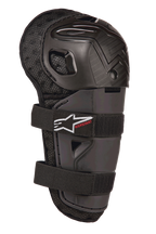 Alpinestars Bionic Action Kickstart Knee Guard, protector de rodilla y espinilla de motocross juvenil, negro, con carcasa de plástico articulada, cierre de doble correa elástica con logo blanco y marca Kickstart en rojo, y respaldo de malla acolchada para protección todoterreno