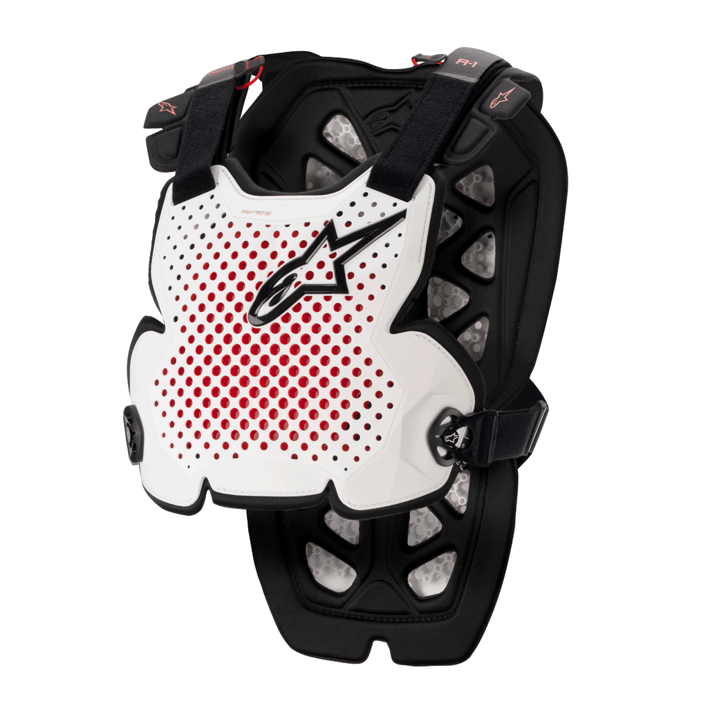 Alpinestars A-1 Pro Chest Protector, peto de motocross, blanco, negro y rojo, con ventilación perforada e interior rojo, logotipo de estrella negro, correas negras ajustables, acolchado protector ligero para carreras off-road