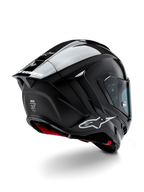 Alpinestars Supertech R10 Solid Helmet, Motorcycle Racing Helmet, Black Carbon Matte and Glossy finish, rear three-quarter view showing carbon fiber shell, aerodynamic spoiler, and Alpinestars branding.