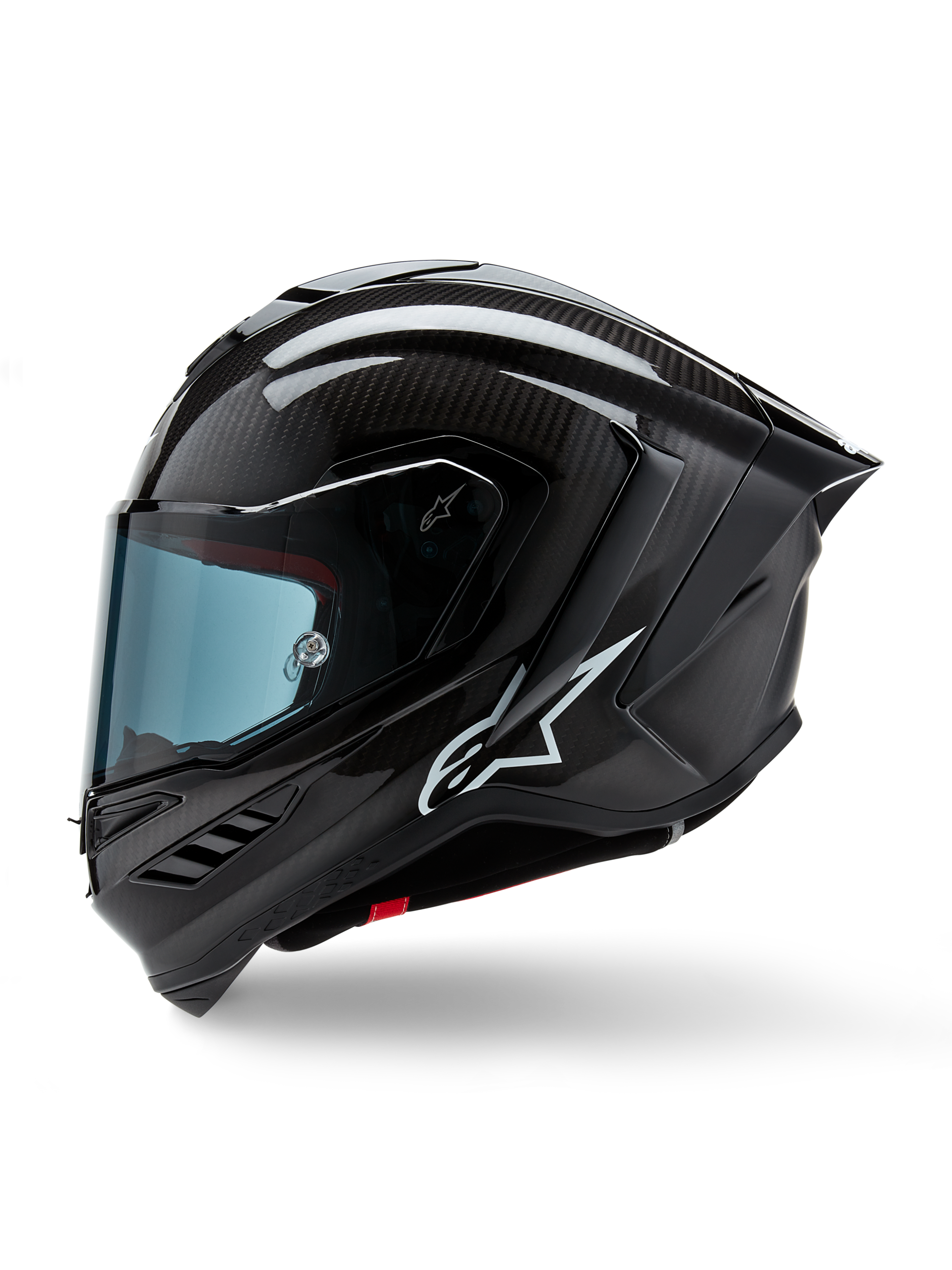 Alpinestars Supertech R10 Solid Helmet, Full-Face Motorcycle Racing Helmet, Black Carbon Matte and Glossy, visible carbon fiber weave pattern, white Alpinestars logo on the side, aerodynamic design with integrated rear spoiler and ventilation ports, side profile view