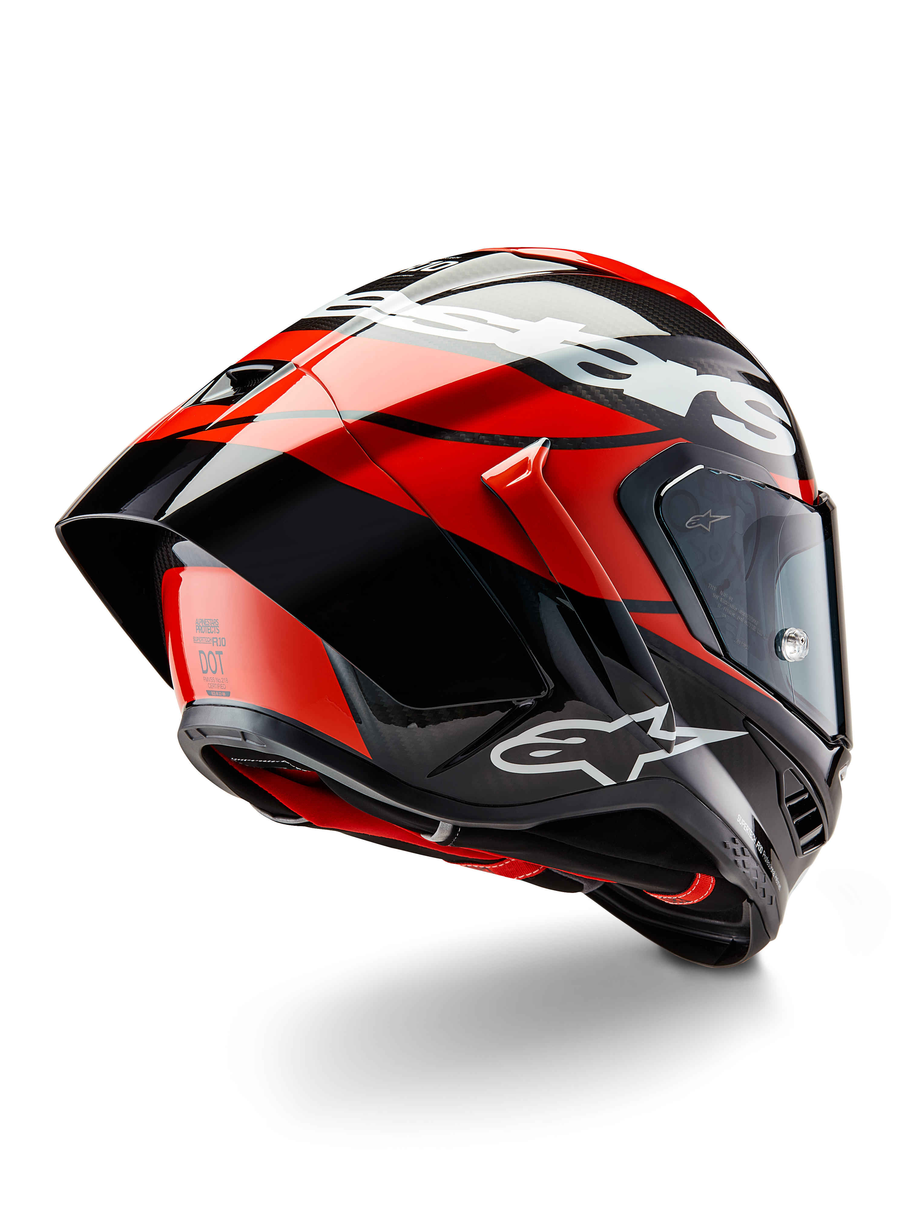 Alpinestars Supertech R10 Element Helmet, Black Carbon Bright Red and White Glossy, rear-three-quarter view showing large aerodynamic spoiler and carbon fiber shell, featuring bold Alpinestars logos and DOT certification