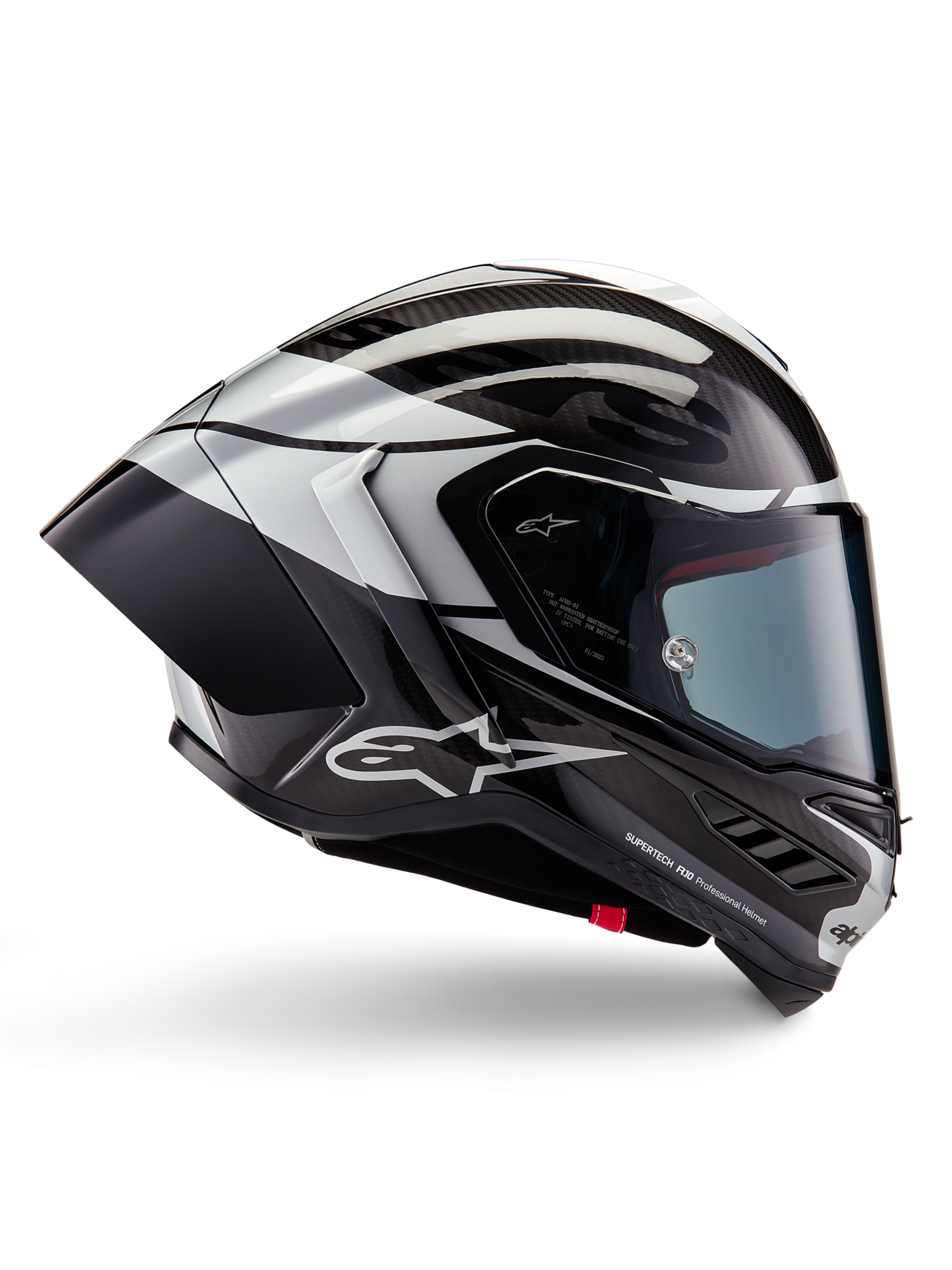 Alpinestars Supertech R10 Element Helmet, Full-Face Motorcycle Racing Helmet, Black Carbon, Silver, and Black Glossy finish, side profile view featuring aerodynamic carbon fiber shell, clear visor, and bold Alpinestars branding