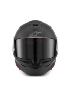 Casco Alpinestars S-R7 Solid, casco de moto integral en negro mate, vista frontal que muestra la calota aerodinámica con visor oscuro, ventilaciones integradas en la mentonera y en la parte superior, y el emblemático logotipo Astar en la frente.