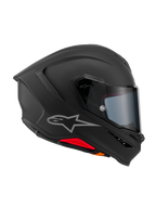Casco Alpinestars S-R7 Solid, casco de moto integral, negro mate, vista de perfil lateral con calota aerodinámica de compuesto de carbono, alerón trasero integrado, logotipo Astars plateado, visor transparente y puertos de ventilación, equipamiento de carreras y conducción deportiva