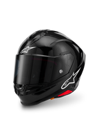 Casco Alpinestars S-R7 Solid, negro brillante, casco integral de motocicleta con calota de compuesto de carbono, logotipos de estrella blancos en la frente y el lateral, diseño aerodinámico con alerón integrado y puertos de ventilación