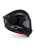 Casco Alpinestars S-R7 Solid, casco de moto integral, negro brillante, vista de perfil con logotipo A-star blanco, calota aerodinámica con alerón integrado y detalles en rojo en la base, diseñado para competición y rendimiento deportivo.