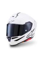 Casco Alpinestars S-R7 Solid, casco de moto integral, blanco brillante, visera ahumada oscura, logotipo de estrella negra en la frente y el lateral, carcasa aerodinámica con puertos de ventilación y detalles en rojo, equipamiento de alto rendimiento para competición y carretera